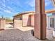 Private courtyard with brick pavers, string lights, and decorative iron gate to home's entrance at 6603 W Via Dona Rd, Phoenix, AZ 85083