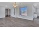 Bright room with tile floors featuring front door and a large window at 6603 W Via Dona Rd, Phoenix, AZ 85083