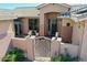 Inviting front entrance with a decorative gate and string lights at 6603 W Via Dona Rd, Phoenix, AZ 85083