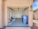 Spacious two-car garage with epoxy flooring, ample storage space, and an open layout at 6603 W Via Dona Rd, Phoenix, AZ 85083