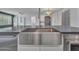 Close up of kitchen island with stainless steel sink and appliances at 6603 W Via Dona Rd, Phoenix, AZ 85083