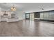 Open-concept living room featuring sleek tile floors and contemporary lighting at 6603 W Via Dona Rd, Phoenix, AZ 85083