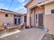 Inviting covered patio featuring comfortable seating and stylish pavers, perfect for outdoor entertaining at 6603 W Via Dona Rd, Phoenix, AZ 85083