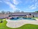 Lush backyard with a beautifully designed pool featuring a rock waterfall, spa, and ample patio space at 6603 W Via Dona Rd, Phoenix, AZ 85083