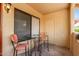 View of balcony featuring a small glass table and two coral colored chairs at 7008 E Gold Dust Ave # 236, Scottsdale, AZ 85253