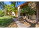 Landscaped lawn and sidewalk in front of a multistory apartment building with balconies at 7008 E Gold Dust Ave # 236, Scottsdale, AZ 85253