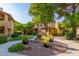 A courtyard with manicured landscaping and a fountain at 7008 E Gold Dust Ave # 236, Scottsdale, AZ 85253