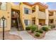 Exterior of a condo complex with manicured landscaping and inviting walkways at 7008 E Gold Dust Ave # 236, Scottsdale, AZ 85253