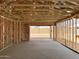 View into the garage of a home under construction showcasing its spaciousness and design at 7688 W Saddlehorn Rd, Peoria, AZ 85383