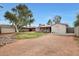 Expansive backyard featuring a large grassy area, shed, block fence and covered patio at 808 W 9Th St, Tempe, AZ 85281