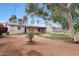 Picture of a backyard with grass area, block fence, patio and mature trees at 808 W 9Th St, Tempe, AZ 85281