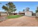 Expansive backyard featuring a well-maintained lawn, mature trees, and a storage shed perfect for outdoor living and storage at 808 W 9Th St, Tempe, AZ 85281