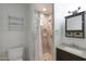 Well-lit bathroom featuring a tiled shower with glass block window and modern fixtures at 808 W 9Th St, Tempe, AZ 85281