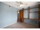 Bright bedroom with natural light, ceiling fan, wood floors and built in shelves at 808 W 9Th St, Tempe, AZ 85281