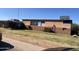 Image of the exterior of a commercial building with brick facade and mature landscaping at 808 W 9Th St, Tempe, AZ 85281