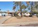 Charming single-story home featuring desert landscaping, a carport, and mature trees shading the front at 808 W 9Th St, Tempe, AZ 85281