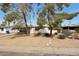 Charming single story home with mature trees and stone pathway leading to the front door at 808 W 9Th St, Tempe, AZ 85281