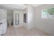 Cozy mud room with tile floors, mirror, natural light, and laundry machines at 808 W 9Th St, Tempe, AZ 85281