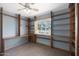 Spacious office room with built-in shelves and custom desk under the window at 808 W 9Th St, Tempe, AZ 85281