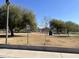 Image of a park featuring mature trees, grassy area, picnic tables, and a sidewalk at 808 W 9Th St, Tempe, AZ 85281