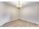 Dining room with wood-look floors and an elegant chandelier at 9165 W Mine Trl, Peoria, AZ 85383