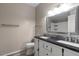 Bright bathroom features dual sinks, a large mirror, and a granite countertop at 9455 E Raintree Dr # 2032, Scottsdale, AZ 85260