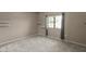 This bedroom features neutral walls, carpet, and a large window providing ample natural light at 9455 E Raintree Dr # 2032, Scottsdale, AZ 85260