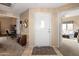 Bright foyer with tile flooring at the entrance and carpet in the hallways and views of the home at 9455 E Raintree Dr # 2032, Scottsdale, AZ 85260