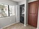 A laundry room with stacked washer and dryer for space-saving efficiency at 9455 E Raintree Dr # 2032, Scottsdale, AZ 85260