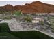 Aerial view of estate showcasing the golf course and surrounding mountain landscape at 9820 E Thompson Peak Pkwy # 841, Scottsdale, AZ 85255