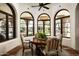 Charming breakfast nook with arched windows providing natural light and scenic views at 9820 E Thompson Peak Pkwy # 841, Scottsdale, AZ 85255