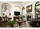 Bright living room features a fireplace with custom mantle and decorative rug at 9820 E Thompson Peak Pkwy # 841, Scottsdale, AZ 85255