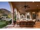 Expansive covered patio with cozy seating area and stunning views at 9820 E Thompson Peak Pkwy # 841, Scottsdale, AZ 85255