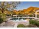 Private pool surrounded by mountain views and lush desert landscaping at 9820 E Thompson Peak Pkwy # 841, Scottsdale, AZ 85255