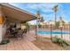 Spacious backyard with covered patio, pool, and mature landscaping at 1018 E Tonto Ln, Phoenix, AZ 85024