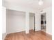 Bedroom view towards walk-in closet and laundry room featuring hardwood floors at 1018 E Tonto Ln, Phoenix, AZ 85024