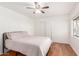 Bright bedroom with hardwood floors, a ceiling fan, and large closet at 1018 E Tonto Ln, Phoenix, AZ 85024