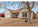 Inviting front exterior of the home features desert landscaping, quaint porch, and a charming rope swing at 1018 E Tonto Ln, Phoenix, AZ 85024