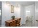 Bright bathroom features a vintage vanity and sink adjacent to the doorway at 10228 W Andover Ave, Sun City, AZ 85351