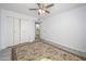 Bedroom featuring hardwood flooring, a closet, and a rug at 10228 W Andover Ave, Sun City, AZ 85351