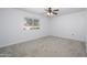 Bright bedroom featuring neutral carpeting, and a window to provide natural light at 10228 W Andover Ave, Sun City, AZ 85351