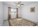 Bedroom featuring hardwood flooring, a ceiling fan, and a rug at 10228 W Andover Ave, Sun City, AZ 85351