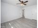 Bedroom featuring hardwood flooring and a doorway leading to another room at 10228 W Andover Ave, Sun City, AZ 85351