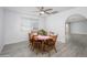 Comfortable dining room with a ceiling fan, archway, and an inviting atmosphere at 10228 W Andover Ave, Sun City, AZ 85351