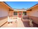 Inviting front entrance with seating and manicured landscape at 10228 W Andover Ave, Sun City, AZ 85351