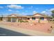 Charming single-story home with attached garage and easy desert front yard landscaping at 10228 W Andover Ave, Sun City, AZ 85351