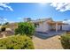 Charming home with a covered patio and low-maintenance landscaping in the front yard at 10228 W Andover Ave, Sun City, AZ 85351