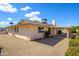 Rear exterior view showcasing the backyard with low-maintenance landscaping at 10228 W Andover Ave, Sun City, AZ 85351