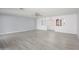 Bright living room with neutral paint, light wood flooring and a ceiling fan at 10228 W Andover Ave, Sun City, AZ 85351