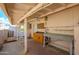 Wide angle view of the covered patio with painted wood framing at 10228 W Andover Ave, Sun City, AZ 85351